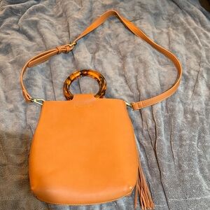 Stylish Tan Handbag with Tortoise Handle